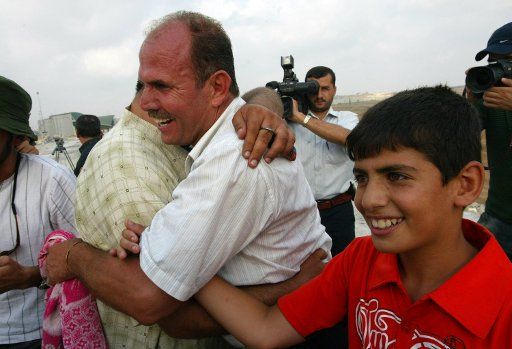Plestinians return into Gaza Strip after passing through the Erez border crossing between Israel and the Gaza Strip on July 29 2007. Israel is allowing approximately 6000 Palestinians to return into the Gaza Strip over the next week. (UPI Photo\/...