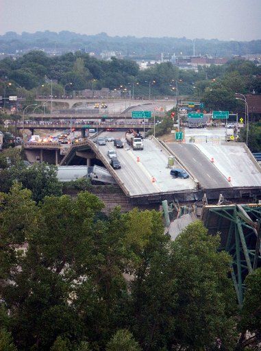 An Interstate Highway bridge ends abruptly where it collapsed into the Mississippi River during rush hour traffic in Minneapolis Minnesota on August 1 2007. Interstate 35W is a major highway leading out of downtown Minneapolis that has been under ...