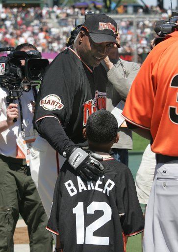 San Francisco Giants All Star Barry Bonds chats with Darren Baker son of Dusty Baker as he waits to take batting practice for the 2007 All Star Game at AT&T Park in San Francisco on July 9 2007. (UPI Photo\/Aaron Kehoe)