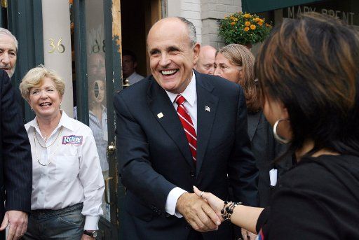 Former New York Mayor and presidential hopeful Rudy Giuliani shakes hands with supporters during a campaign stop at the City Coffee House & Creperie in Clayton Missouri on October 4 2007. (UPI Photo\/Bill Greenblatt)