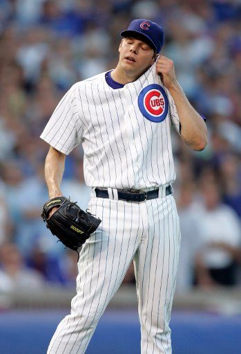 Chicago Cubs starting pitcher Rich Hill wipes his face after giving up a solo home run on his first pitch against the Arizona Diamondbacks at the start of game 3 of the NLDS at Wrigley Field in Chicago October 10 2007. (UPI Photo\/Mark Cowan)