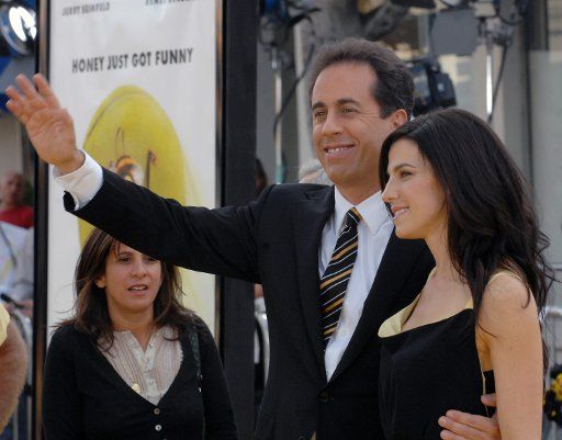 Cast member Jerry Seinfeld (L) who lends his voice to character Barry B. Benson in the animated motion picture "Bee Movie" arrives with his wife Jessica at the premiere of the film in Los Angeles on October 28 2007. (UPI Photo\/Jim Ruymen)