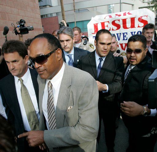O.J. Simpson (C) and his attorney Yale Galanter (L) arrive at court for the start of his arraignment hearing in Las Vegas on November 8 2007. Simpson\