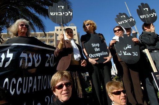 Israeli Jews and Palestinian women hold a joint demonstration against the Israeli occupation in downtown Jerusalem December 28 2007. Two Israeli settlers were killed today by Palestinian gunmen in a drive-by shooting near Hebron. (UPI Photo\/...