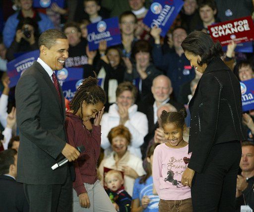 Democratic candidate Senator Barack Obama with wife Michelle and daughters Malia (left) and Natasha makes a campaign stop at Roosevelt High School while campaigning for the Iowa Caucus in Des Moines Iowa on January 1 2008. (UPI Photo\/Laura ...
