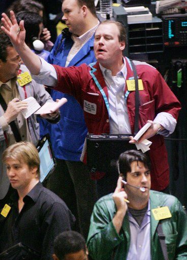 Traders conduct business in the oil trading pit as the price of oil eases its way towards $100 per barrel at the New York Mercantile Exchange on January 3 2008 in New York City. The price briefly hit $100 per barrel yesterday as the U.S. dollar ...