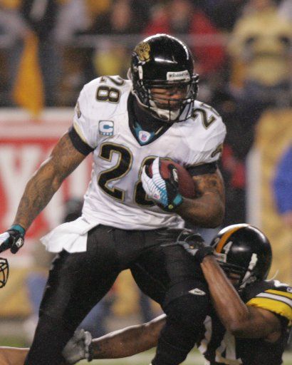 Jacksonville Jaguars Fred Taylor runs over Pittsburgh Steelers Ike Taylor during the first quarter at Heinz Field in Pittsburgh Pennsylvania on January 5 2008..(UPI Photo\/Stephen Gross)