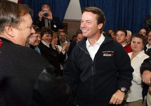 Democratic presidential hopeful Sen. John Edwards (R) greets suppporters before delivering a speech at the Carpenters Hall in St. Louis on January 19 2008. (UPI Photo\/Bill Greenblatt)