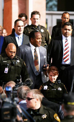 O.J. Simpson leaves court following his arraignment hearing in Las Vegas on November 28 2007. Simpson is charged with a total of twelve charges including eleven felonies ranging from kidnapping and burglary to robbery and assault with a deadly ...