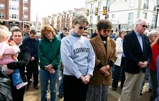 Kirkwood residents pause for a prayer during a rededication of the City Hall council chambers in Kirkwood Missouri on March 1 2008. Five people were killed when a gunman burst into the chambers during a meeting on February 7. (UPI Photo\/Bill ...