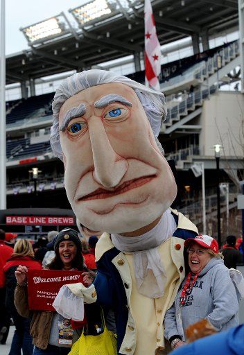 Fans enter the new Washington Nationals $600 million ballpark and are greeting by former President Thomas Jefferson on March 30 2008 in Washington. The Nationals play the Atlanta Braves as the Major League Baseball season begins in earnest. (UPI ...