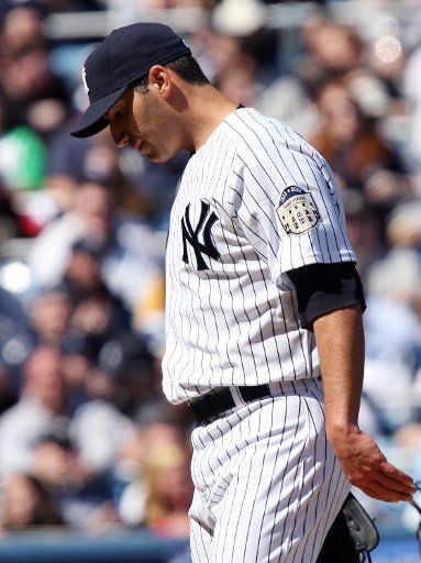 New York Yankees Andy Pettitte walks back to the dug out with his head down in the third inning against the Tampa Bay Rays at Yankee Stadium in New York City on April 5 2008. (UPI Photo\/John Angelillo) .