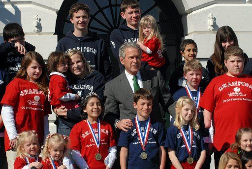 U.S. President George W. Bush participates in a photo opportunity with Childrens Miracle Network Champion Children on the South Portico of The White House on March 17 2008. (UPI Photo\/Roger L. Wollenberg)