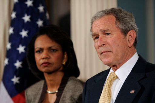 U.S. President George W. Bush right makes remarks to the press as Secretary of State Condolezza Rice looks on at the State Department in Washington on March 24 2008. (UPI Photo\/Ken Cedeno\/POOL)