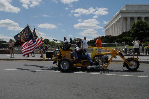 Motorcyclists ride by the Lincoln Memorial during Memorial Day weekend in Washington on May 24 2008. Members of the Rolling Thunder organization a veterans advocacy organization that works for the return of prisoners of war and missing in action ...