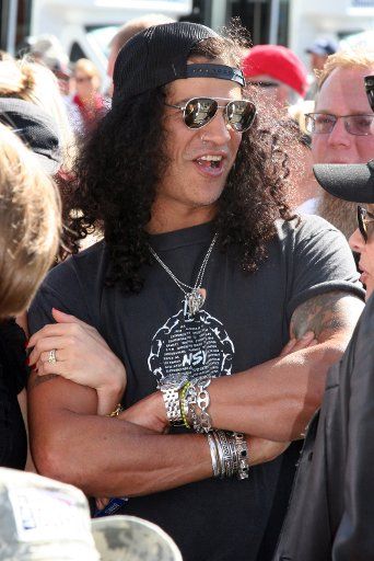 Slash guitarist for the band Velvet Revolver talks with fans before the 92nd running of the Indianapolis 500 at the Indianapolis Motor Speedway on May 25 2008 in Indianapolis. (UPI Photo\/Ed Locke)