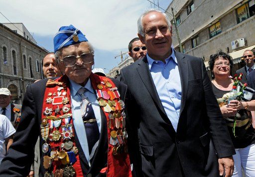 Likud leader Benjamin Netanyahu walks with a Russian Jewish veteran of World War II in a Victory Day parade in Jerusalem marking the anniversary of the victory of the Allies over Nazi Germany May 11 2008. The (UPI Photo\/Debbie Hill)