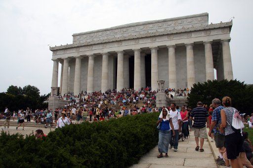 Members of the public wait for the fireworks show to begin on the Mall in Washington on July 4 2008. (UPI Photo\/Jack Hohman)