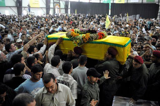 The Lebanese resistance movement Hezbollah holds a funeral for seven of its fighters on July 18 2008. The seven were killed in the 2006 war with Israel and were part of a prisoners swap between the two countries. Israel received the bodies of two ...