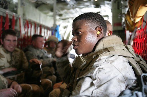 U.S. Navy Hospitalman Miranda waits aboard an aircraft to depart the Kandahar Air Field in Afghanistan headed to Camp Barber on June 3 2008. (UPI Photo\/Lance Cpl. Jason T. Guiliano\/Department of Defense)