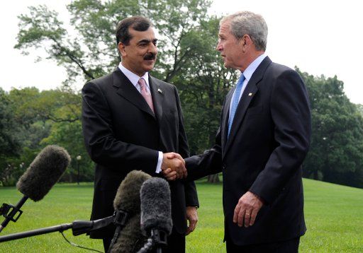 U.S. President George W. Bush (R) shakes hands with the Prime Minister of Pakistan Syed Yousuf Raza Gilani following a media briefing on their meeting on the South Lawn of the White House in Washington on July 28 2008. (UPI Photo\/Kevin Dietsch)