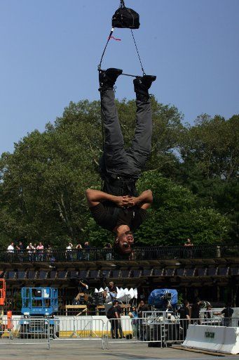 Magician David Blaine hangs upside down in Central Park\