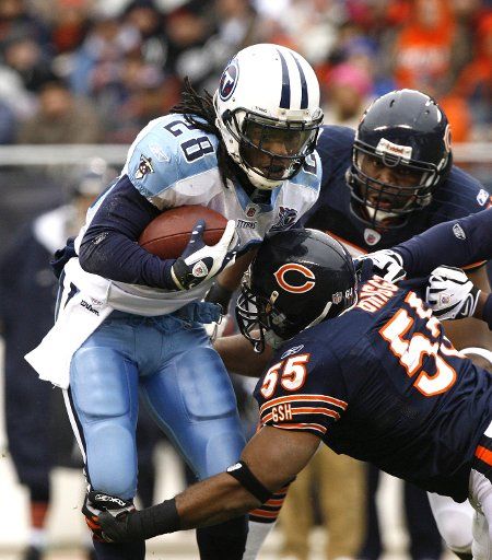 Chicago Bears linebacker Lance Briggs (55) stops Tennessee Titans running back Chris Johnson for a 3-yard loss during the second quarter at Soldier Field in Chicago on November 9 2008. (UPI Photo\/Brian Kersey)