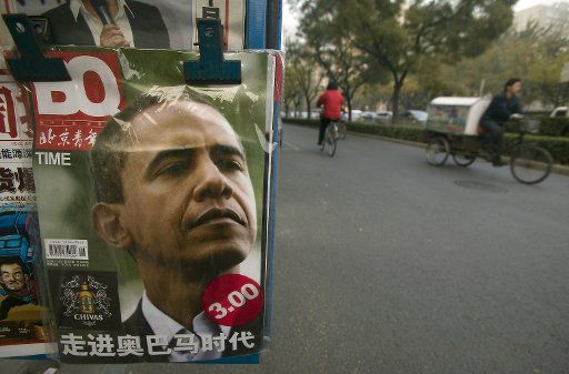A Chinese news vendor sells magazines featuring U.S. President-elect Barack Obama as its cover story on a sidewalk in downtown Beijing November 14 2008. (UPI Photo\/Stephen Shaver)