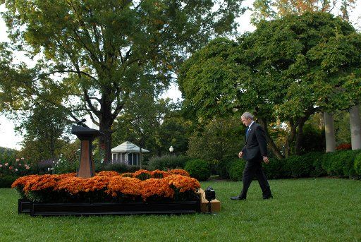 U.S. President George W. Bush makes his way to the podium to speak on the economy in the Rose Garden at the White House in Washington on October 14 2008. Bush announced a $250 billion plan in which the government would buy shares in the nation\