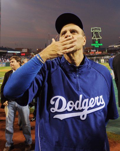 Los Angeles Dodgers Manager Joe Torre blows a kiss to a fan prior to the Dodgers-Phillies game one of Major League Baseball\
