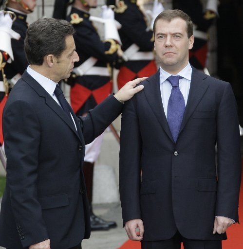 French President Nicolas Sarkozy (L) greets Russian President Dmitry Medvedev before their meeting during the EU-Russia summit in Nice French Riviera on November 14 2008. Sarkozy urged Russia and the United States to stop threatening each other ...