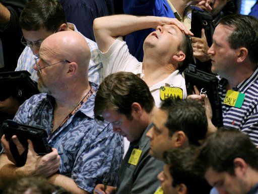 A trader reacts in the oil options pit at the New York Mercantile Exchange after oil hit a record high of over $147 per barrel on July 11 2008 in New York. The price increase was spurred by fears of supply disruptions and growing tensions with Iran ...