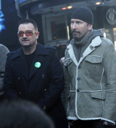 Band members of U2 Bono (L) and The Edge participate in a ceremony renaming a portion of West 53rd street and Broadway "U2 Way" in New York on March 3 2009. (UPI Photo\/Ezio Petersen)