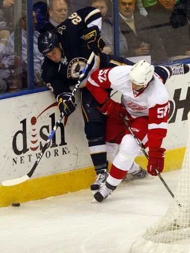 Detroit Red Wings Jonathan Ericsson of Sweden (52) puts St. Louis Blues B.J. Crombeen into the boards in the first period at the Scottrade Center in St. Louis on March 3 2009. (UPI Photo\/Bill Greenblatt)