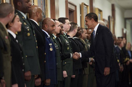 U.S. President Barack Obama greets service men and women after a meeting at the Pentagon in Arlington Virginia on January 28 2009. (UPI Photo\/Brendan Smialowski\/Pool)