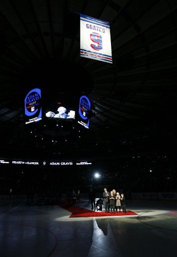 Adam Graves and his family watch his New York Rangers Jersey raised and hung from the Rafters on Adam Graves Night at Madison Square Garden in New York City on February 3 2009. (UPI Photo\/John Angelillo)