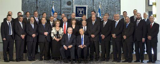 New Israeli Prime Minister Benjamin Netanyahu (center L) President Shimon Peres (center R) and members of Netanyahu\