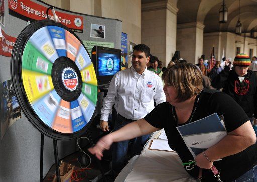 A participant spins a game wheel during the Earth Day Festival and Open House at the Environmental Protection Agency in Washington on April 22 2009. (UPI Photo\/Kevin Dietsch)