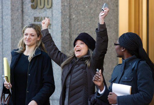 Miriam Siegman celebrates outside Federal Court where Bernard Madoff plead guilty to securities fraud charges in New York City on March 12 2009. (UPI Photo\/John Angelillo)