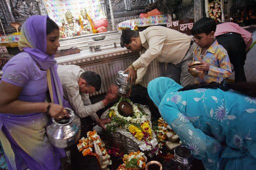 Indian Buddhists pray in a temple in New Delhi India on March 12 2009. (UPI Photo\/Mohammad Kheirkhah)