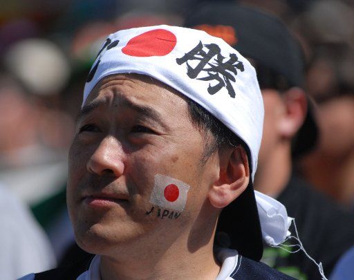 A fan of the Japanese baseball team enjoys the game as Japan plays Cuba at Petco Park during the World Baseball Classic in San Diego March 15 2009. ( UPI Photo\/Earl S. Cryer)
