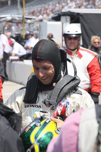 Bruno Junqueira is all smiles after qualifying a car he had only just stepped into today May 17 2009 at the Indianapolis Motor Speedway in Indianapolis Indiana. (UPI Photo\/Ed Locke)