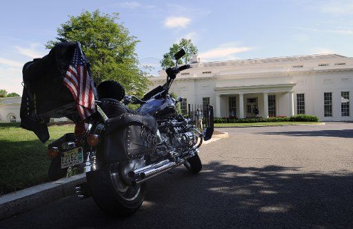 A motorcycle belonging to members of the Rolling Thunder POW\/MIA advocacy group is parked outside the West Wing of the White House in Washington on May 22 2009. The annual Rolling Thunder rally kicks off this weekend to mark Memorial Day. (UPI ...