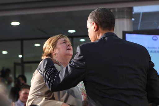 President Barack Obama talks to Deborah Smith from Appalachia Virginia during a national discussion on health care through a town hall meeting at Northern Virginia Community College in Annandale Virginia on July 1 2009. (UPI Photo\/Dennis Brack\/...