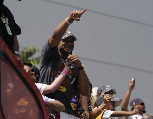 Derek Fisher points to the fans as the 2009 NBA Champion Lakers celebrate their 15th NBA Championship with a parade in Los Angeles on June 17 2009. (UPI Photo\/ Phil McCarten)