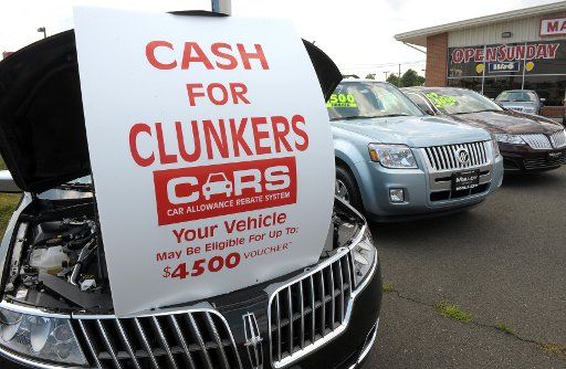 A sign at Malloy Lincoln Mercury advertises the Cars Allowance Rebate System (CARS) program also known as "Cash for Clunkers" in Manassas Virginia on July 27 2009. The program is based on a cash incentive for people to trade in older vehicles ...