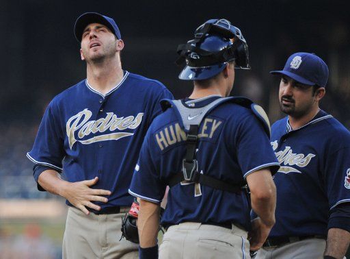San Diego Padres pitches Jon Garland reacts as he talks with catcher Nick Hundley and first baseman Adrian Gonzalez during the first inning against the Washington Nationals at Nationals Park in Washington on July 7 2010. UPI\/Kevin