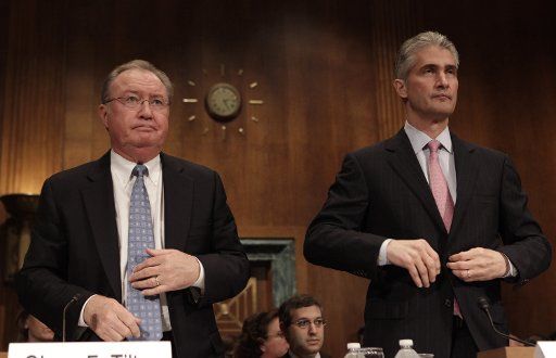 Glenn Tilton (L) president and CEO of United Airlines and Jeffery Smisek president and CEO of Continental Airlines arrive to testify before the Senate Antitrust Competition Policy and Consumer Rights Subcommittee hearing on The United\/...
