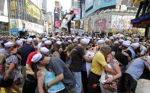 Participants of the "Times Square Kiss In" reenact the famous photo of a sailor kissing a nurse at the end of World War II in Times Square in New York City on August 14 2010. UPI\/John Angelillo