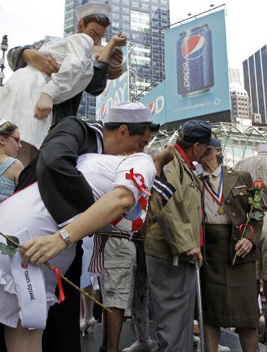 Participants of the "Times Square Kiss In" reenact the famous photo of a sailor kissing a nurse at the end of World War II in Times Square in New York City on August 14 2010. UPI\/John Angelillo .
